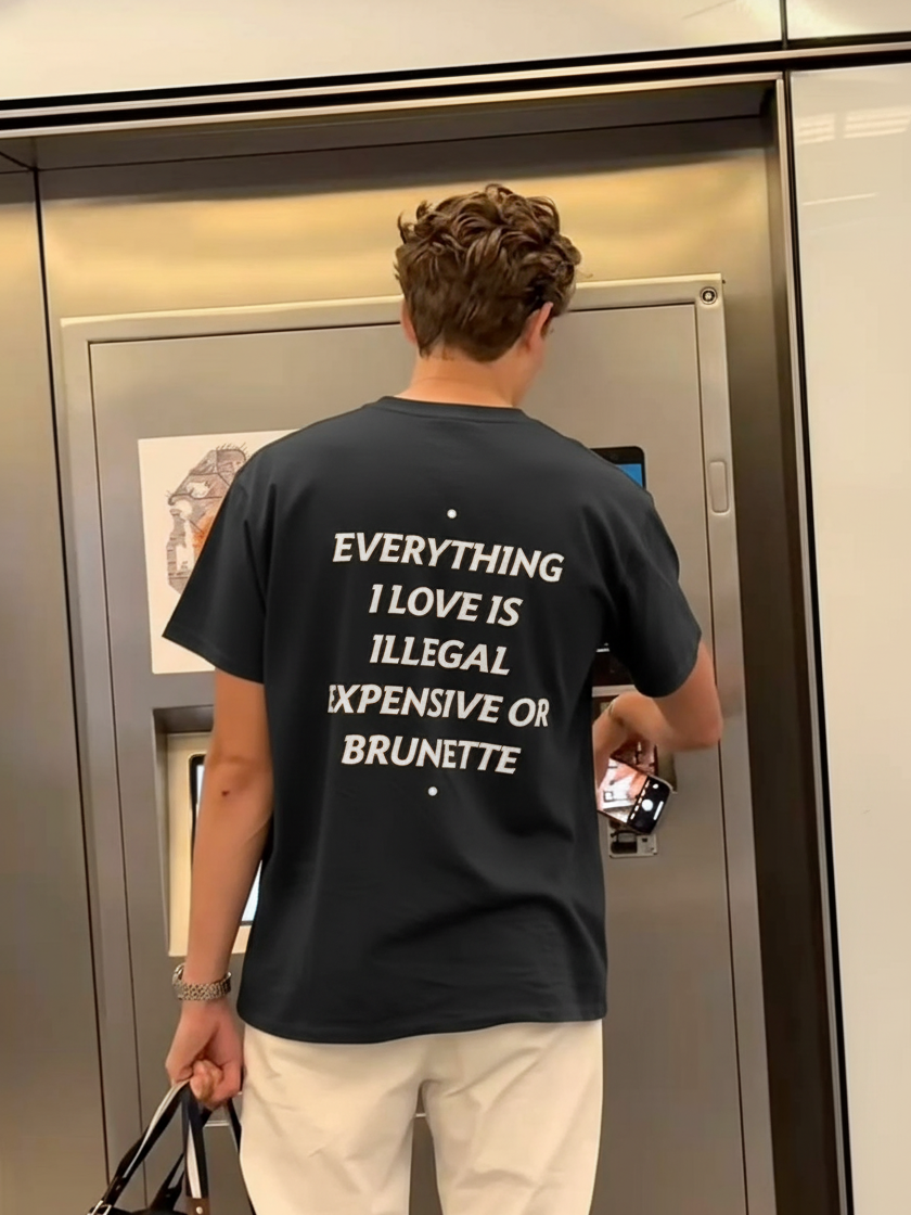 EVERYTHING I LOVE IS ILLEGAL, EXPENSIVE OR BRUNETTE oversized T-shirt, front view